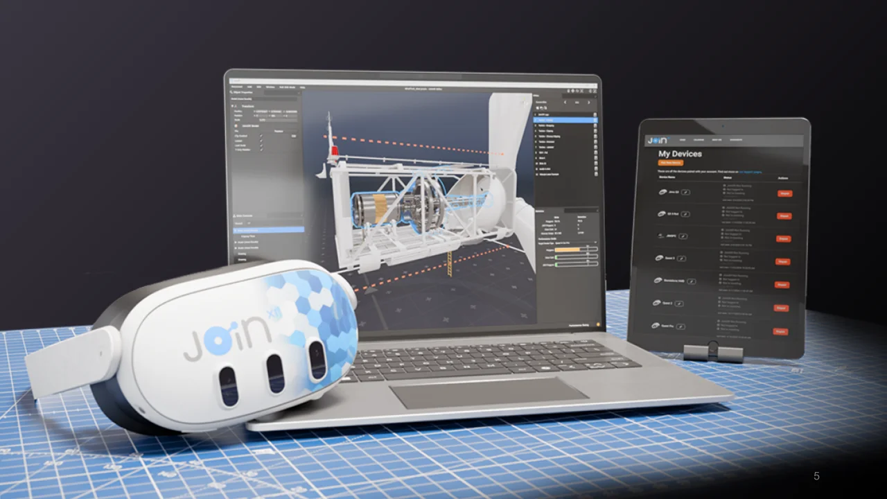 A VR headset, a laptop and an iPad all running the JoinXR software.