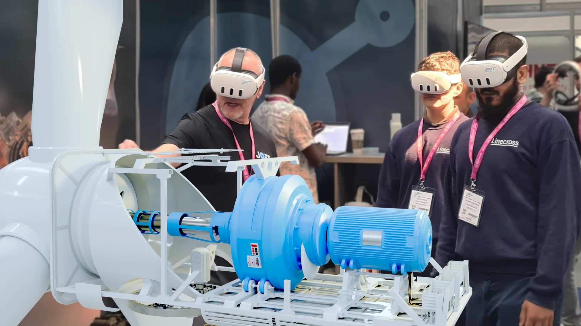 A technical trainer explains the operation of a wind turbine to a pair of trainees using VR headsets and JoinXR software.